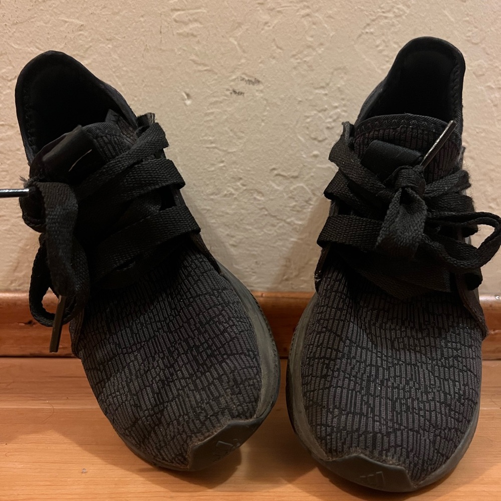 Well worn Adidas shoes